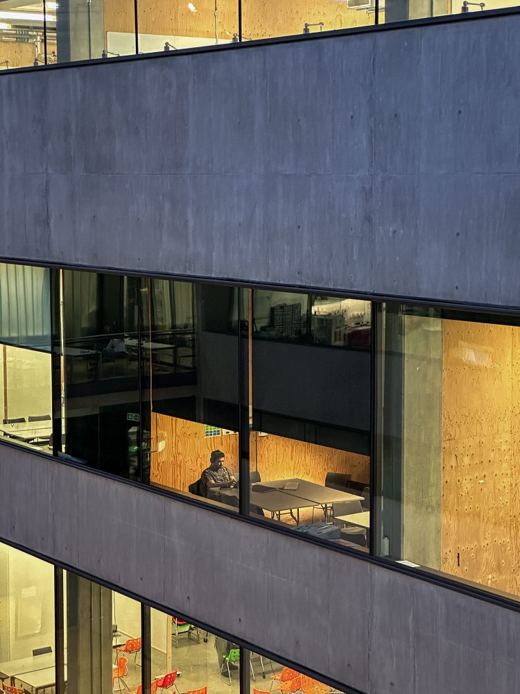 A man at work in an office building.